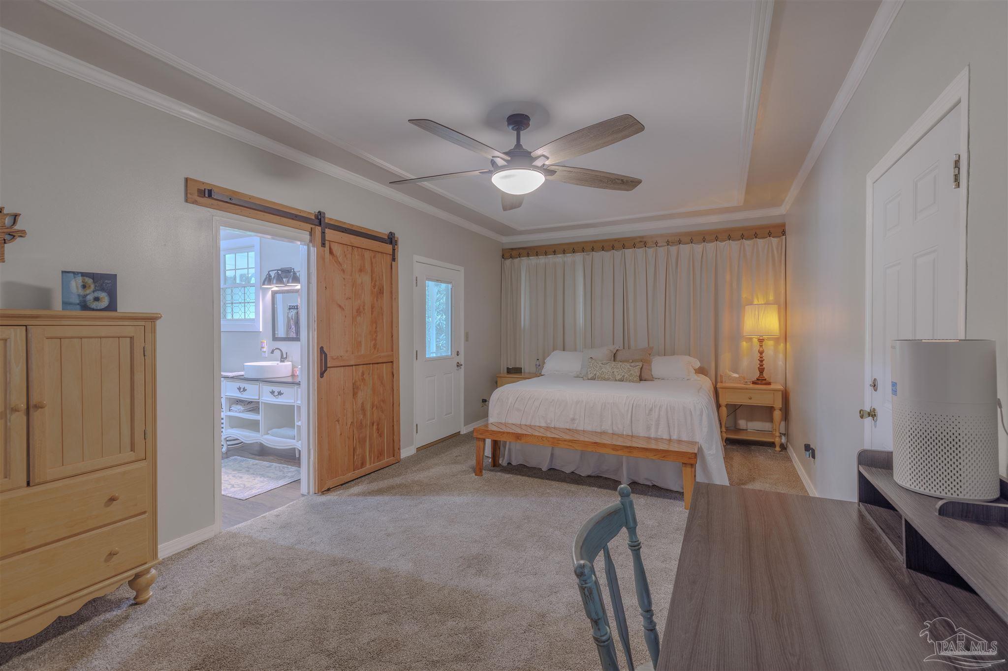 5049 Guernsey Road Pace, FL 32571 - Photo 37 of 61 a spacious bedroom with a bed and a dresser