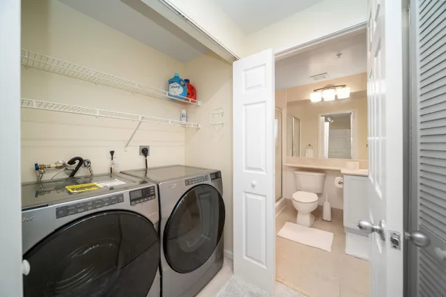 a view of a storage & utility room with washer and dryer