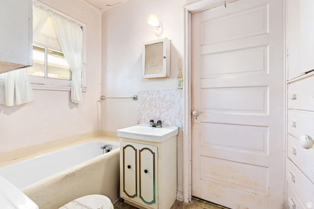 658 Wasatch Street Midvale, UT 84047 - Photo 16 of 31 Pedestal sink with built-in cabinet, wall-mounted medicine cabinet, paneled interior door, and built-in storage drawers