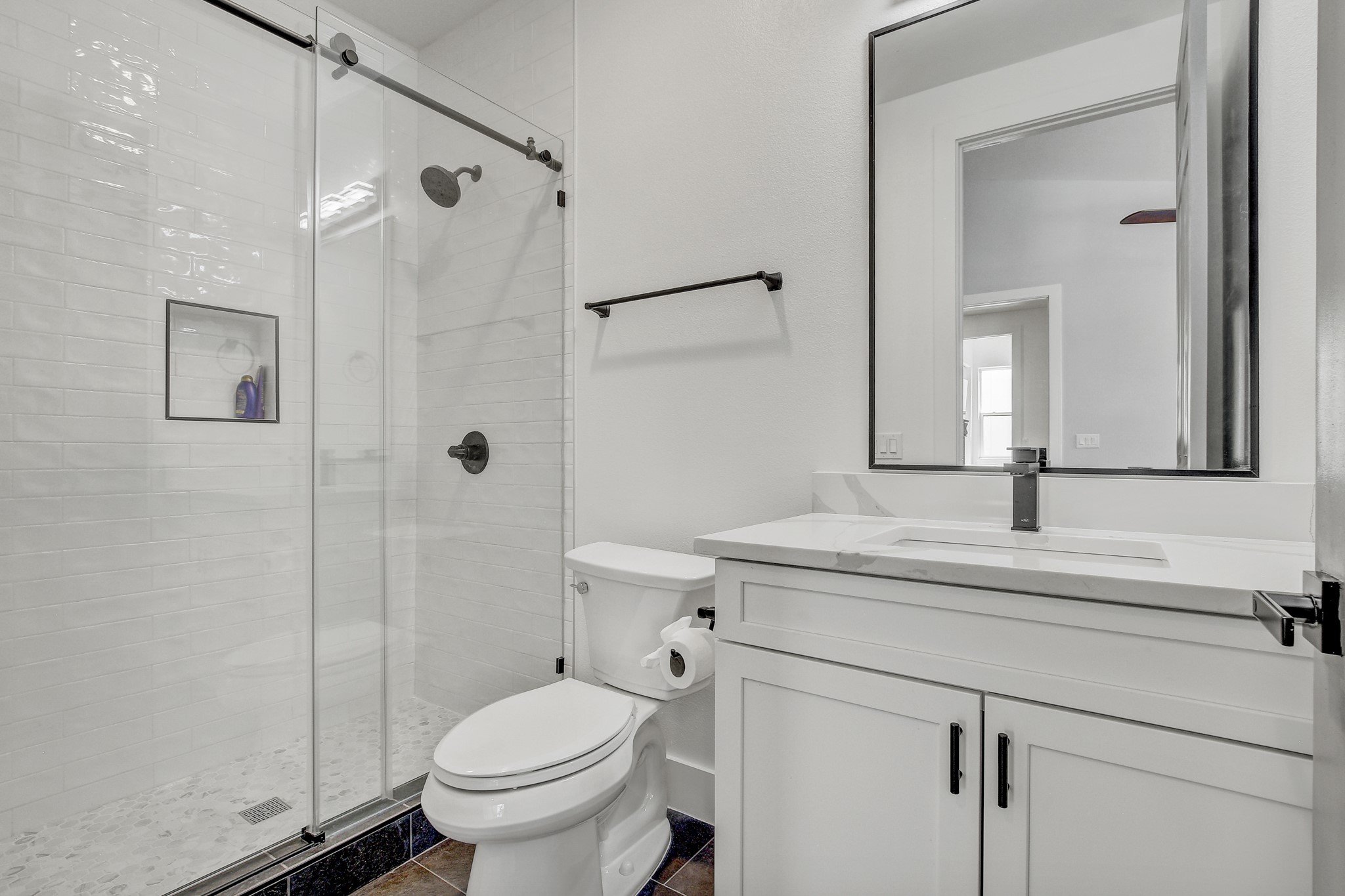 4703 Louis Avenue, Unit A Austin, TX 78721 - Photo 27 of 35 Bathroom with vanity and a stall shower