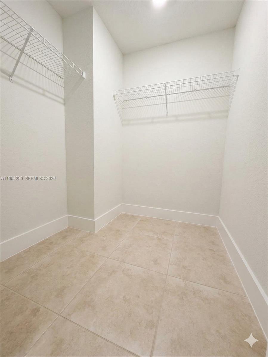 2801 Riverside Drive, Unit 204 Coral Springs, FL 33065 - Photo 12 of 20 a view of a room with racks on the wall