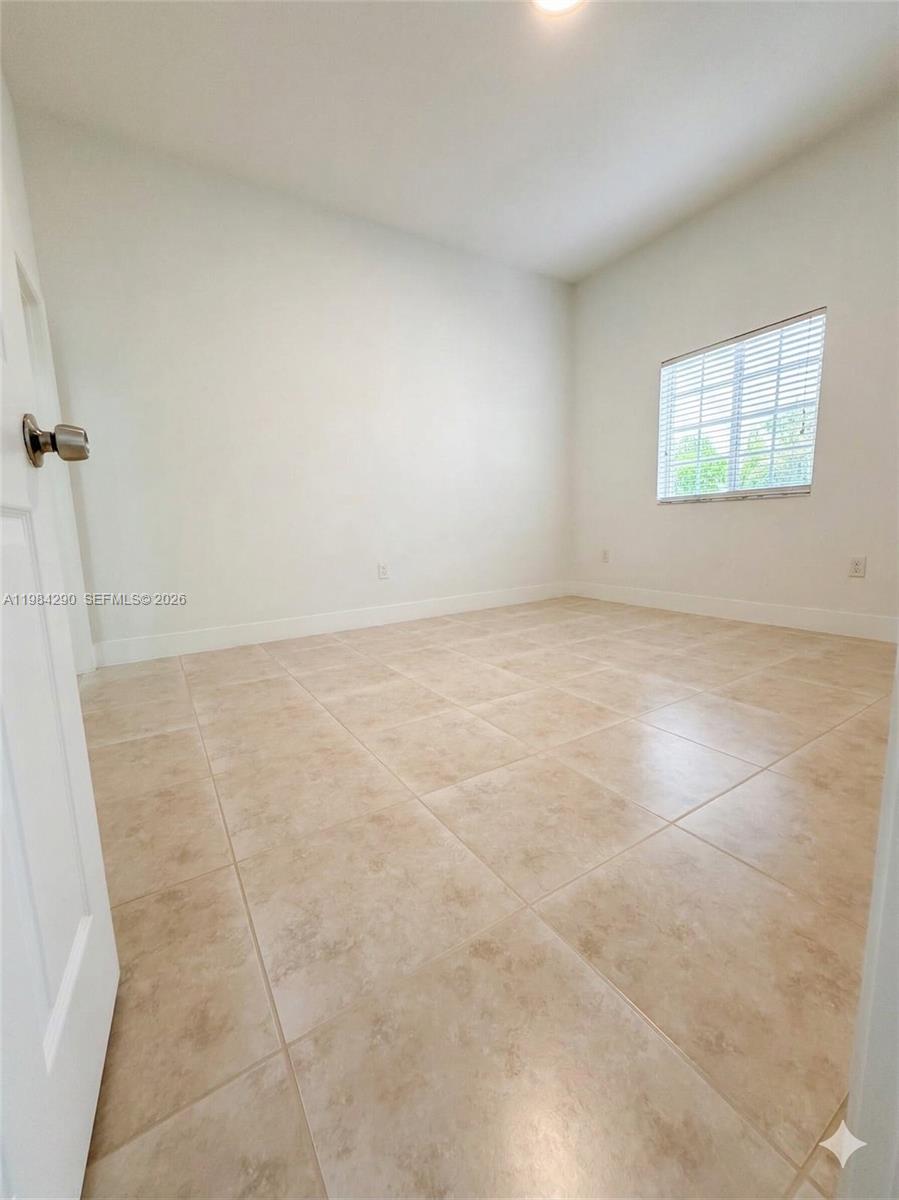 2801 Riverside Drive, Unit 204 Coral Springs, FL 33065 - Photo 15 of 20 an empty room with a empty space and windows