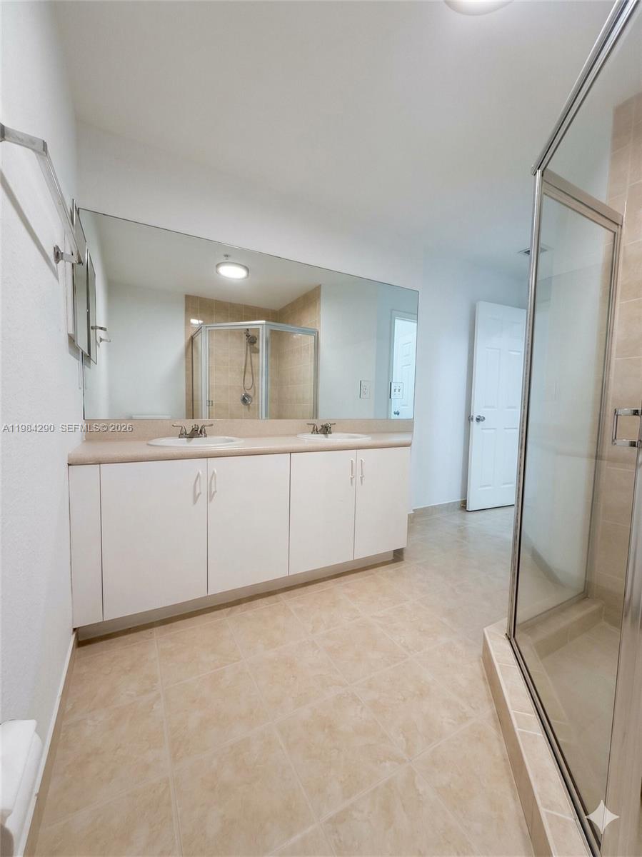 2801 Riverside Drive, Unit 204 Coral Springs, FL 33065 - Photo 18 of 20 a large white kitchen with a sink and refrigerator