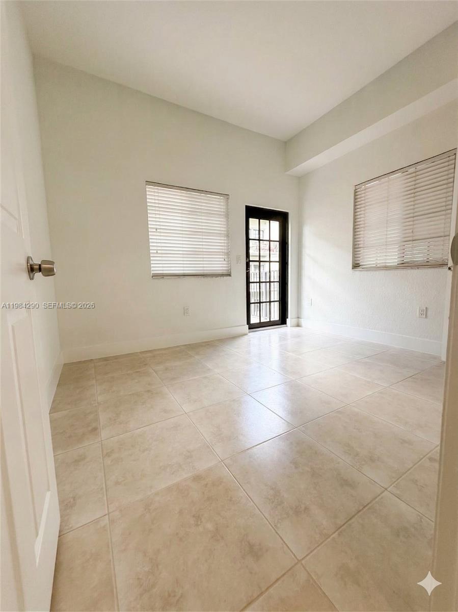 2801 Riverside Drive, Unit 204 Coral Springs, FL 33065 - Photo 19 of 20 a view of an empty room with a window