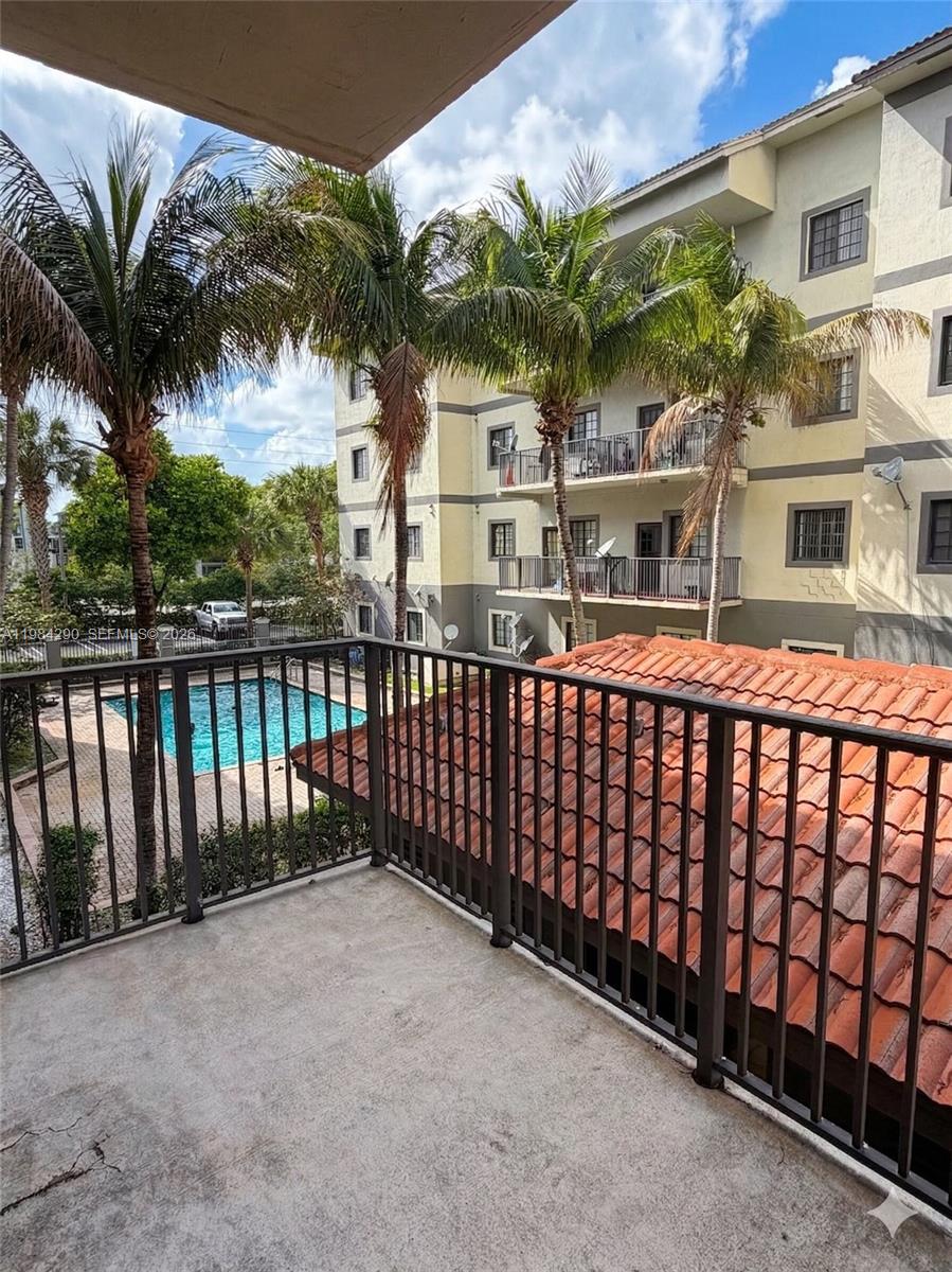 2801 Riverside Drive, Unit 204 Coral Springs, FL 33065 - Photo 20 of 20 a front view of a house with a iron gate