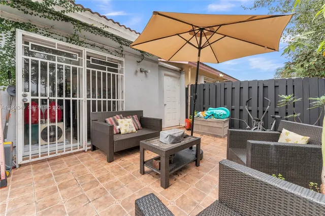 a outdoor space with patio the couches and a potted plant