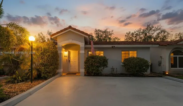 a front view of a house with garden