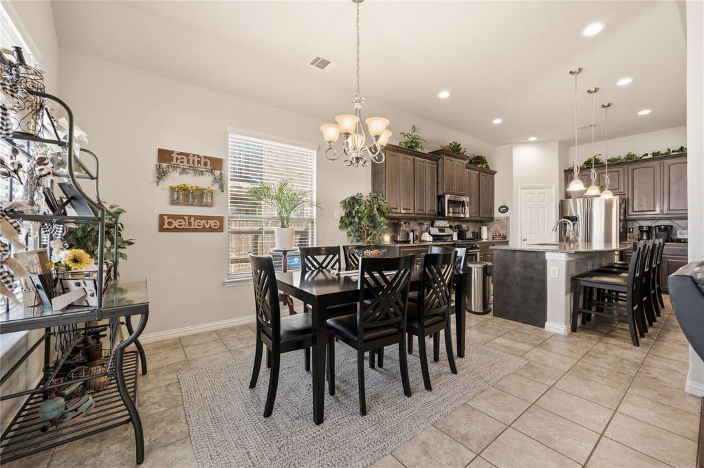 140 Chestnut Road Waxahachie, TX 75165 - Photo 16 of 26 Open-concept dining area and kitchen featuring tile flooring, recessed lighting, and a window with blinds