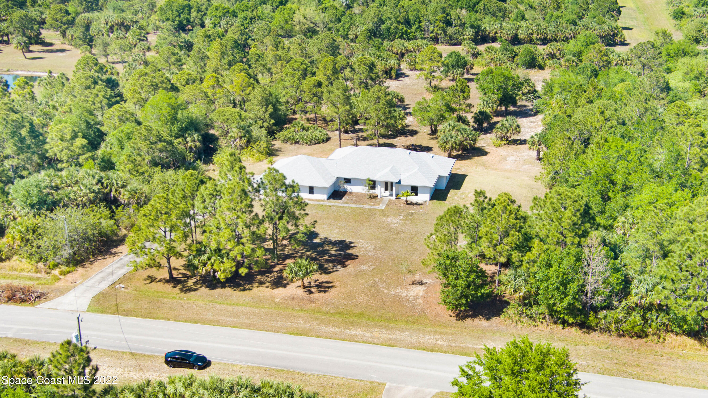 174 Deer Run Road Palm Bay, FL 32909 - Photo 1 of 1 an aerial view of residential houses with outdoor space