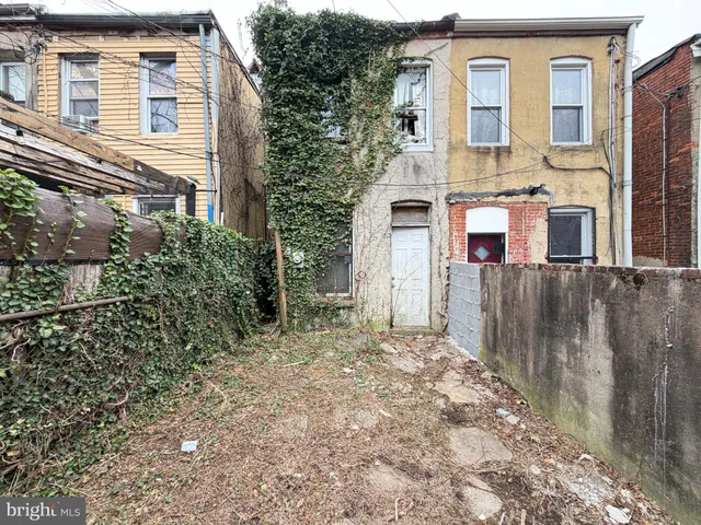 a view of a car parked in front of a building