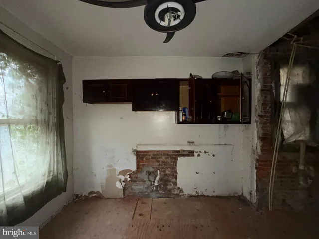 a view of storage and utility room with washer and dryer