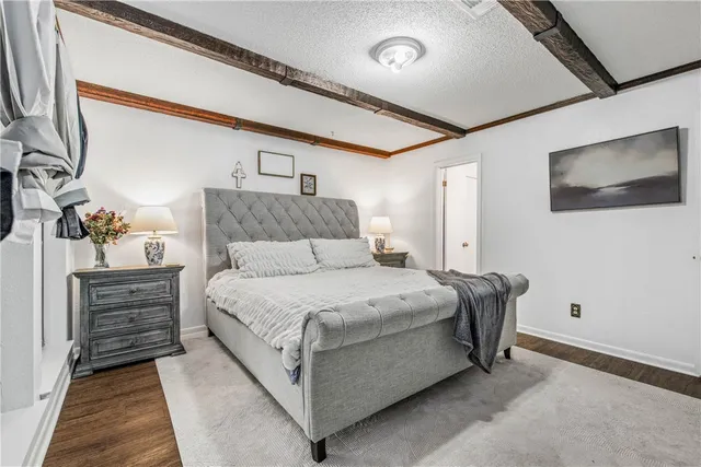 a spacious bathroom with a granite countertop double vanity sink and a mirror