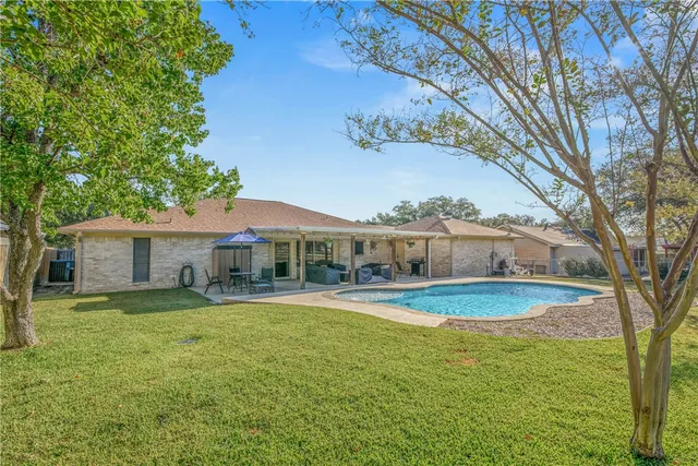 a view of a house with a swimming pool