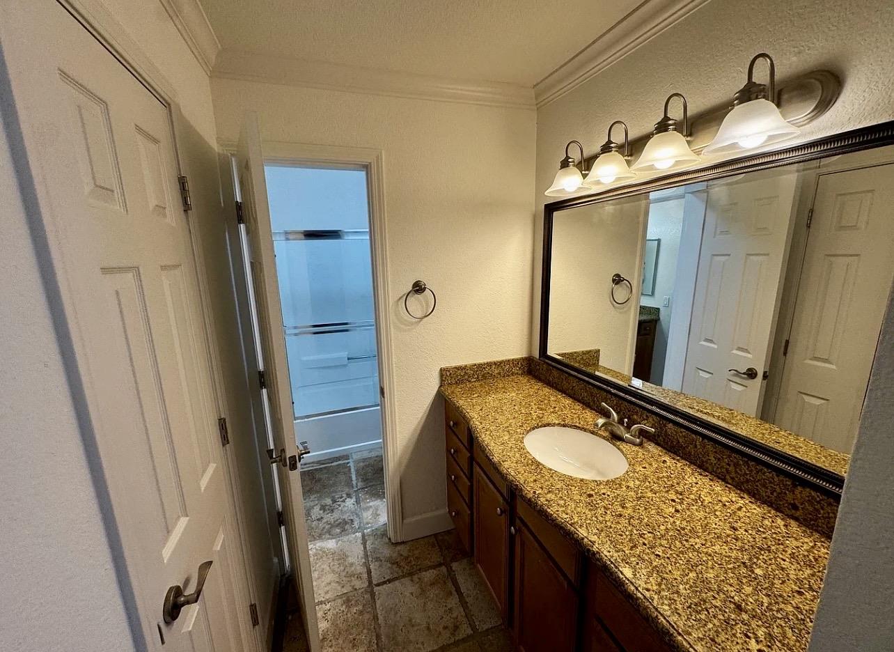 331 Eastridge Drive San Ramon, CA 94582 - Photo 10 of 15 a bathroom with a granite countertop sink and a mirror