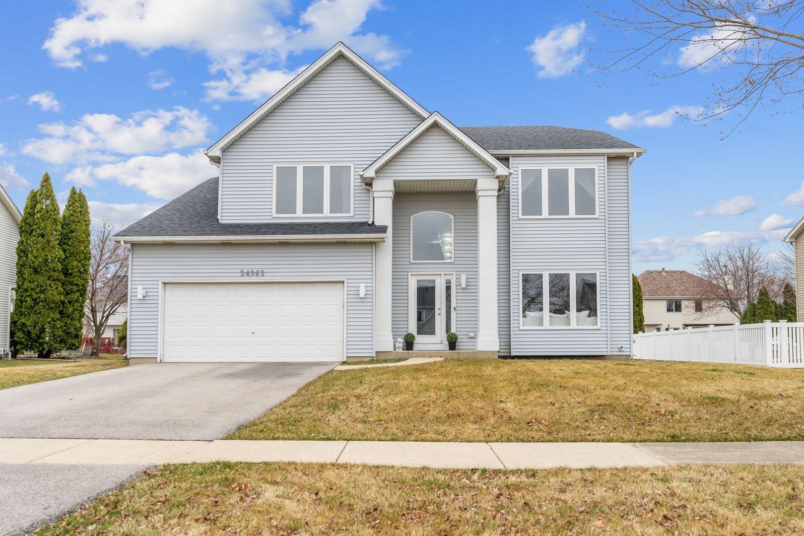 24962 Ambrose Road Plainfield, IL 60585 - Photo 1 of 28 a front view of a house with a yard and garage