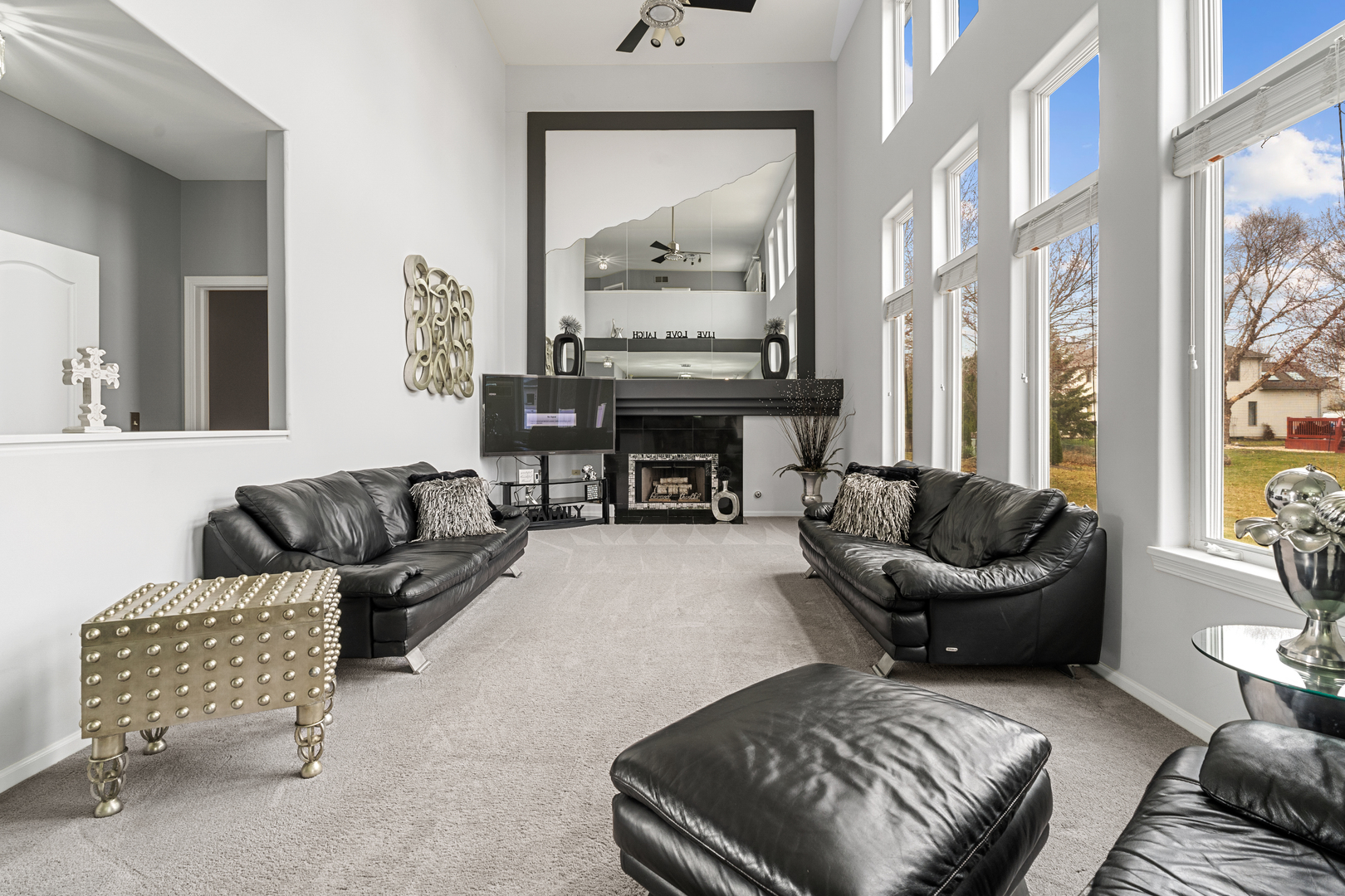 24962 Ambrose Road Plainfield, IL 60585 - Photo 11 of 28 a living room with furniture and a fireplace