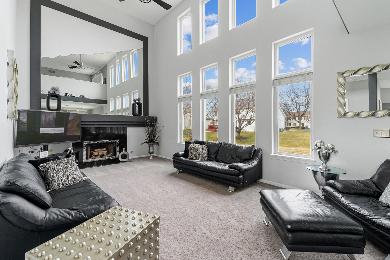 24962 Ambrose Road Plainfield, IL 60585 - Photo 12 of 28 a living room with furniture and a fireplace