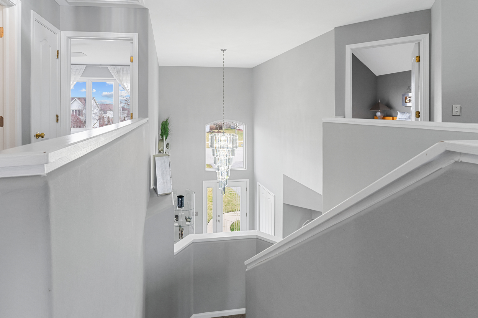 24962 Ambrose Road Plainfield, IL 60585 - Photo 19 of 28 a view of a hallway view with wooden floor and staircase