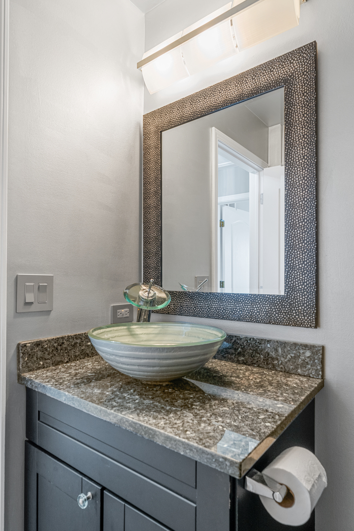 24962 Ambrose Road Plainfield, IL 60585 - Photo 27 of 28 a bathroom with a granite countertop sink and a mirror