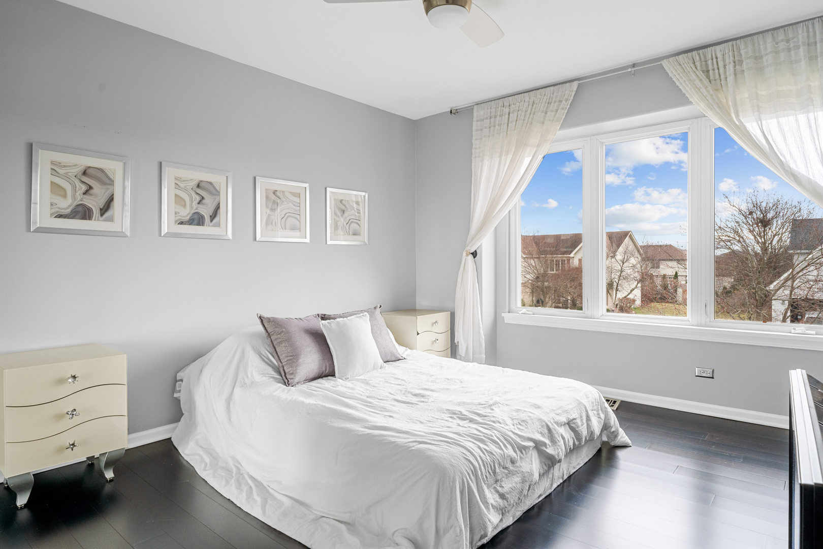 24962 Ambrose Road Plainfield, IL 60585 - Photo 28 of 28 a bedroom with a bed and a large window