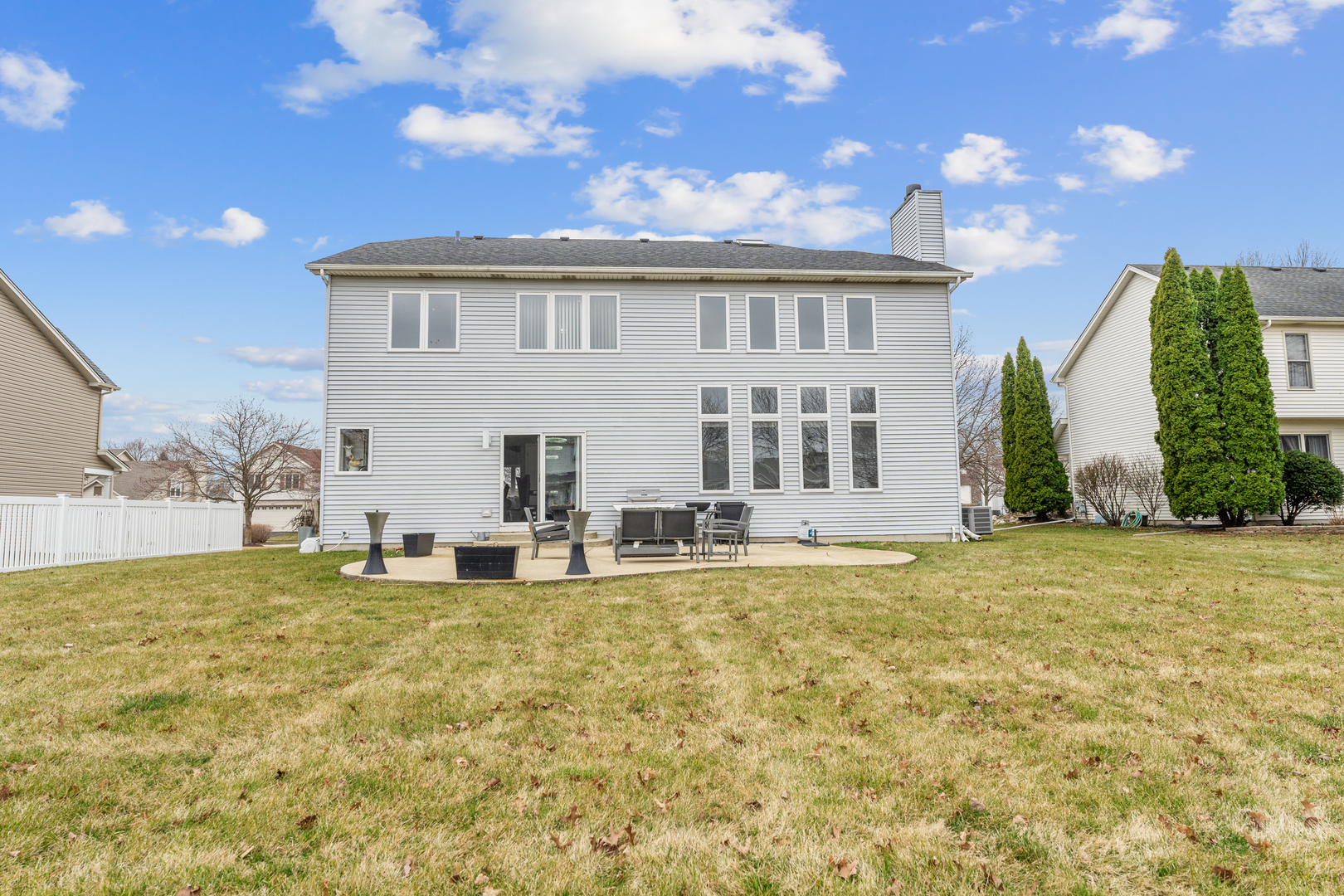 24962 Ambrose Road Plainfield, IL 60585 - Photo 4 of 28 a view of a house with a backyard and a patio