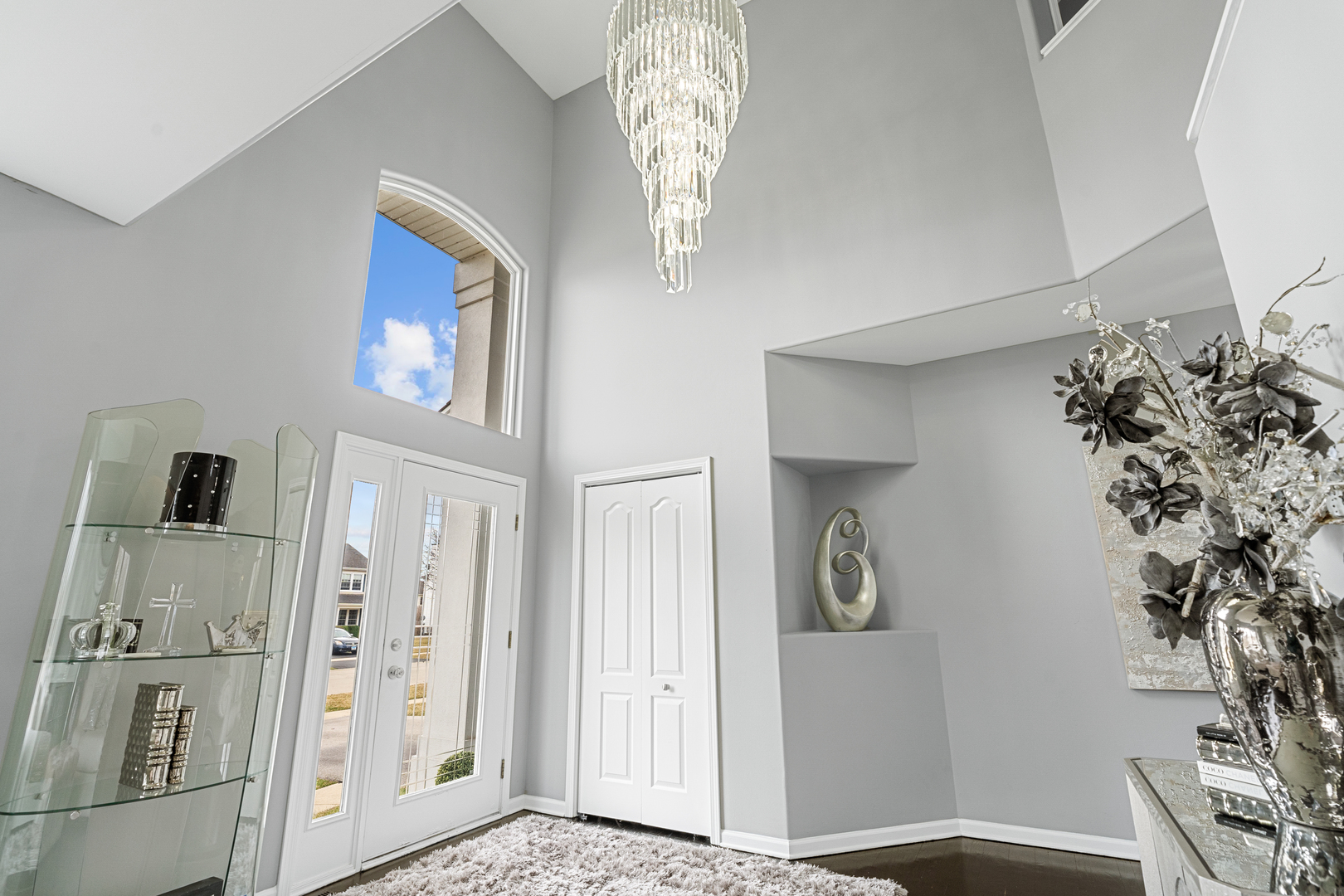 24962 Ambrose Road Plainfield, IL 60585 - Photo 7 of 28 a view of a hallway with entryway wooden floor and front door