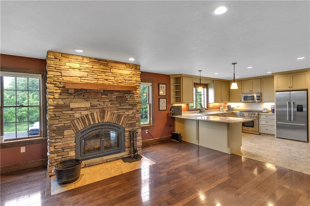 39 Caven Road Ligonier, PA 15658 - Photo 29 of 33 Kitchen / Family Room area of the Guest Home has a wood-burning fireplace and hidden laundry area.