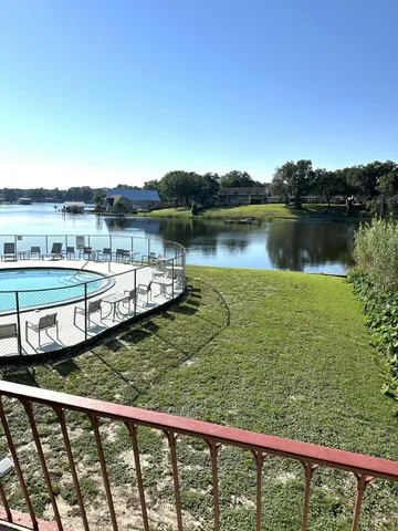 a view of a lake from a balcony