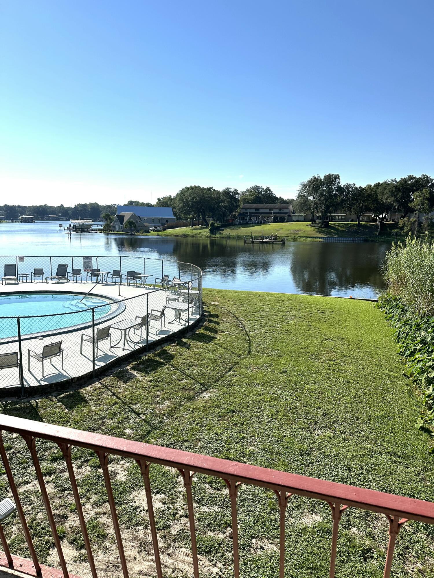 210 Pelham Road, Unit 208C Fort Walton Beach, FL 32547 - Photo 13 of 13 a view of a lake from a balcony