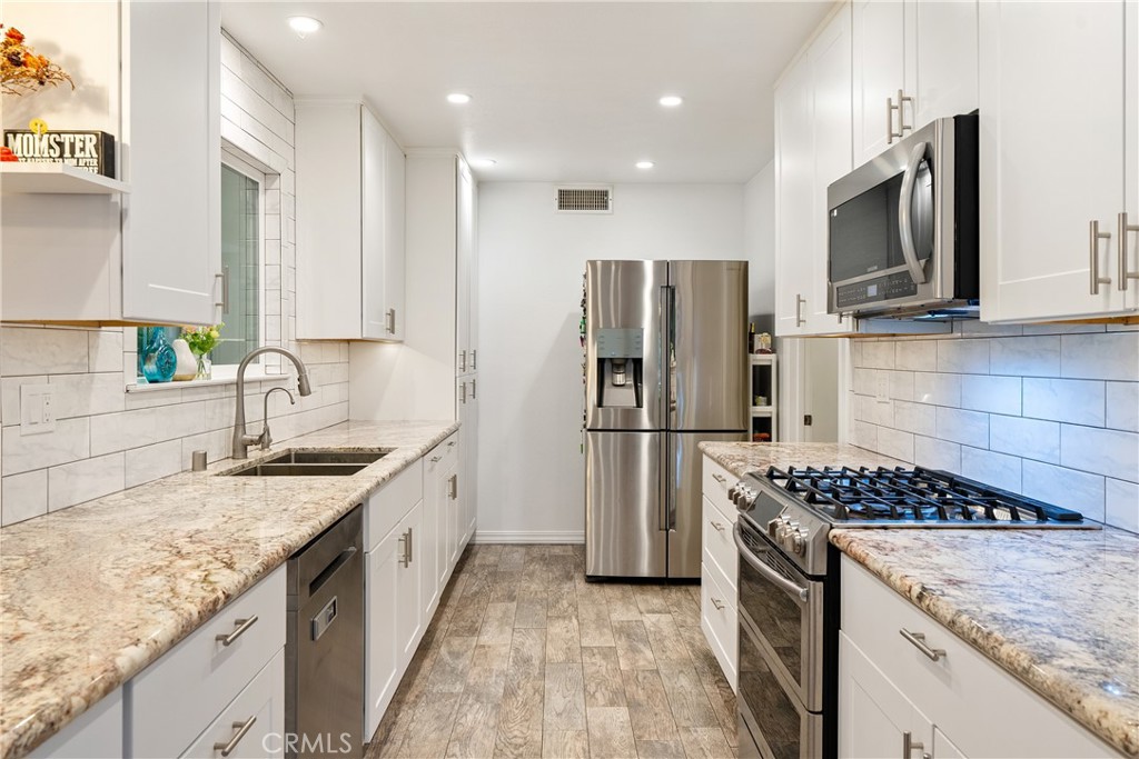 3388 Ramona Road Atascadero, CA 93422 - Photo 13 of 55 The kitchen provides ample cabinetry for storage and abundant countertop space for preparing or serving meals. The refrigerator stays!