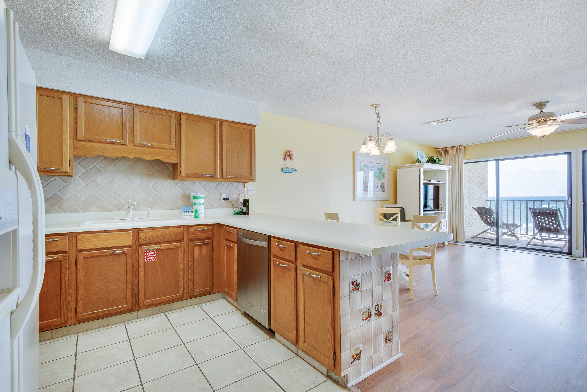 214 Blue Mountain Road, Unit 124 Santa Rosa Beach, FL 32459 - Photo 13 of 30 a kitchen with stainless steel appliances granite countertop a sink and cabinets