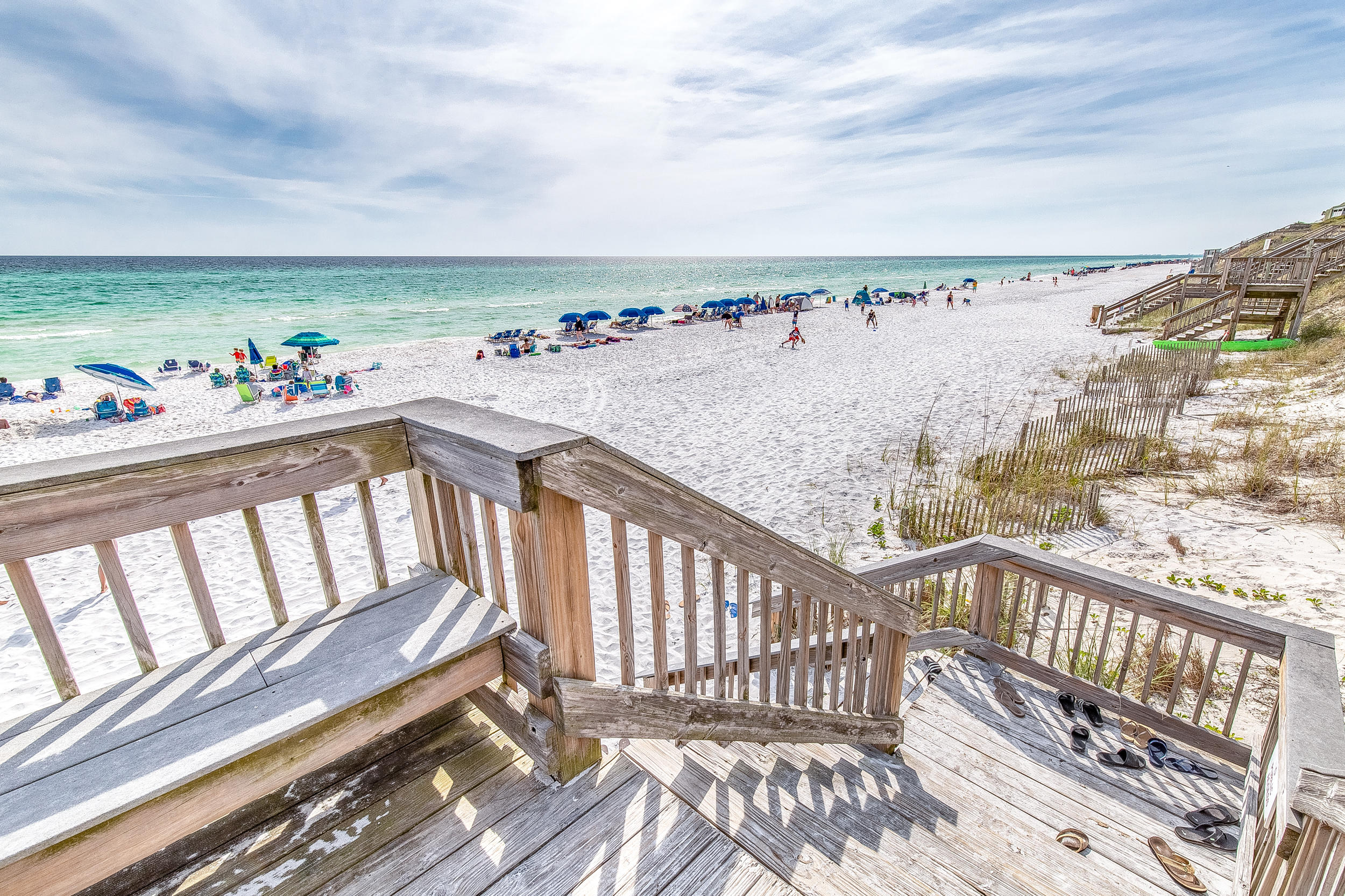 214 Blue Mountain Road, Unit 124 Santa Rosa Beach, FL 32459 - Photo 26 of 30 a view of a balcony with wooden chairs