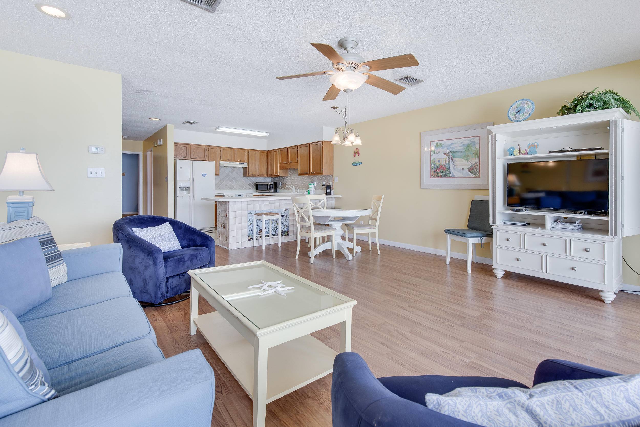 214 Blue Mountain Road, Unit 124 Santa Rosa Beach, FL 32459 - Photo 9 of 30 a living room with furniture and a flat screen tv