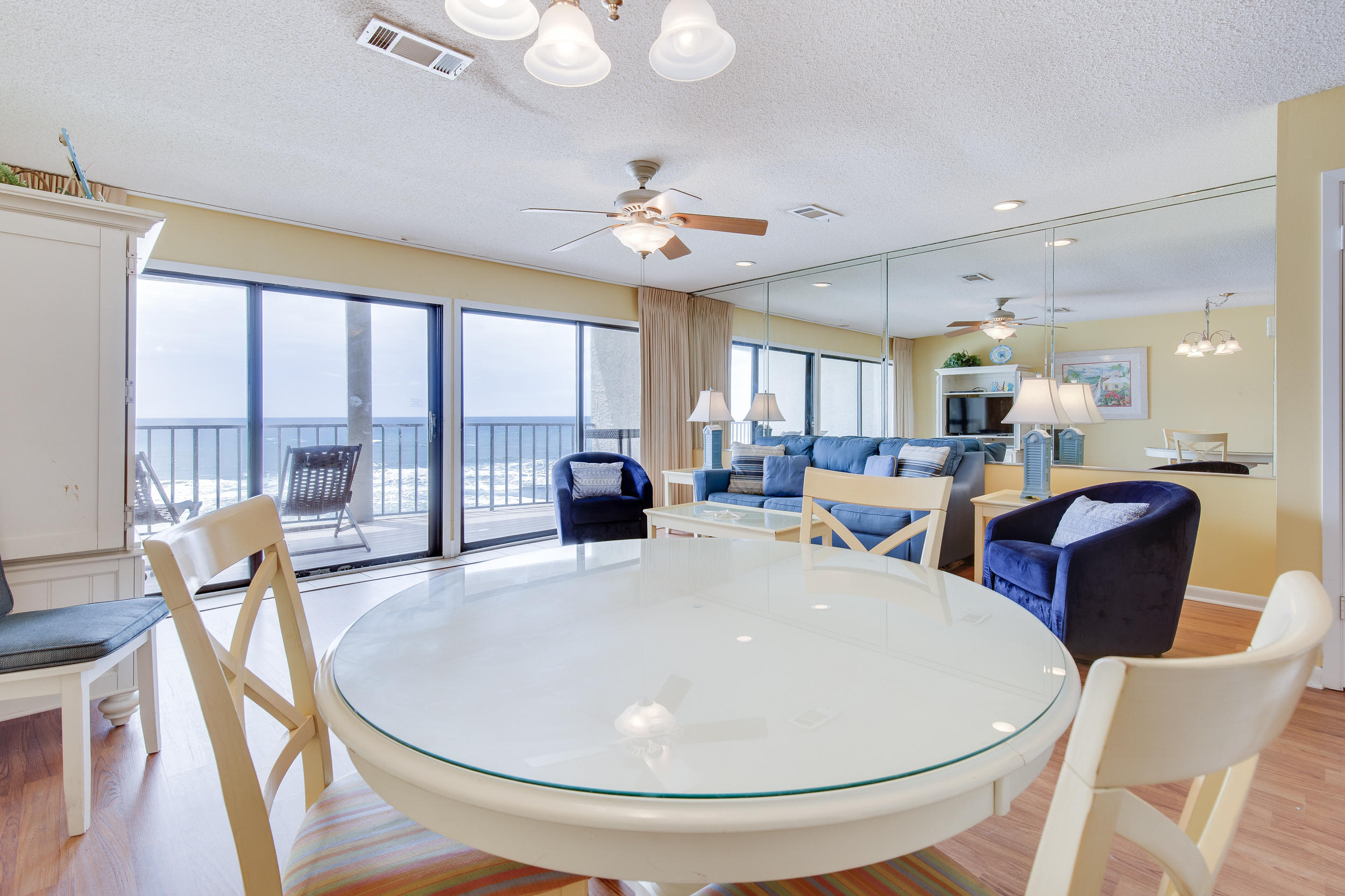 214 Blue Mountain Road, Unit 124 Santa Rosa Beach, FL 32459 - Photo 10 of 30 a very nice looking dining room with furniture a chandelier and wooden floor