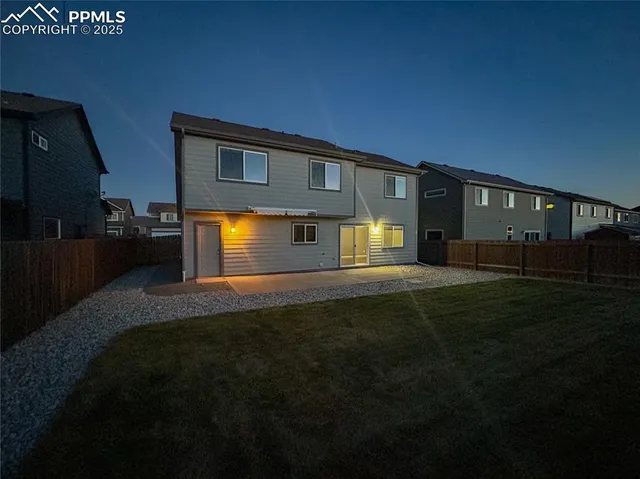 a front view of house and yard with seating space