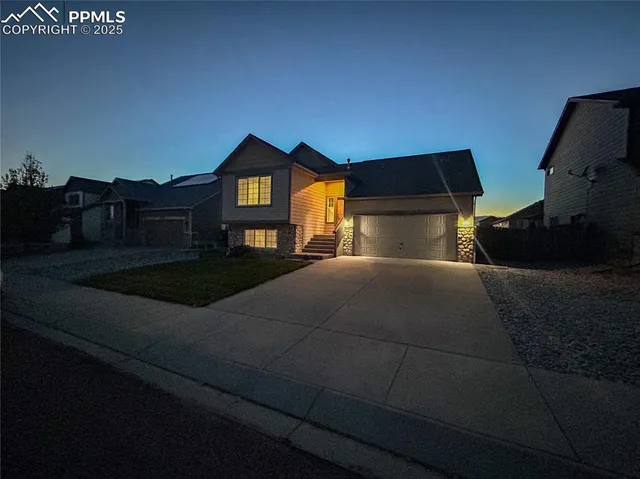 a bedroom with a bed and a night stand