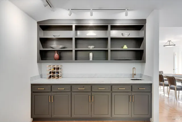 a kitchen with cabinets and a stove