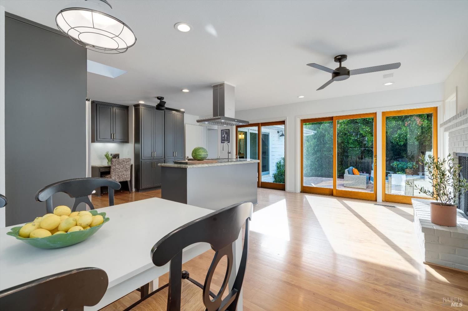 1777 Adams Street St. Helena, CA 94574 - Photo 13 of 31 a view of a dining room with furniture large windows and wooden floor
