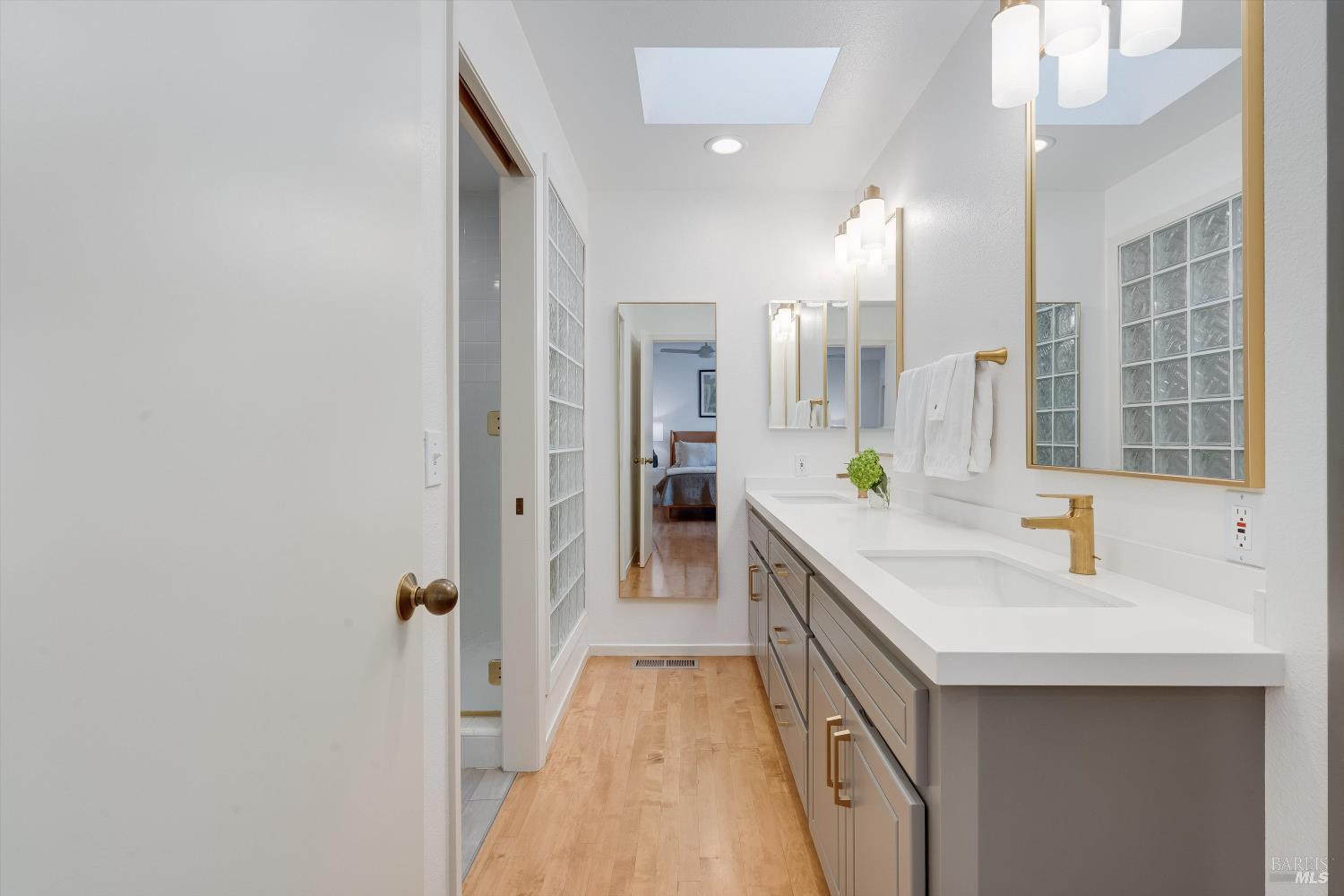 1777 Adams Street St. Helena, CA 94574 - Photo 19 of 31 a spacious bathroom with a double vanity sink a mirror and a bathtub