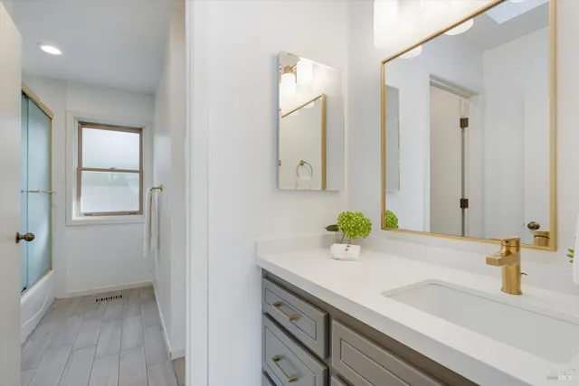 a bathroom with a sink and a mirror