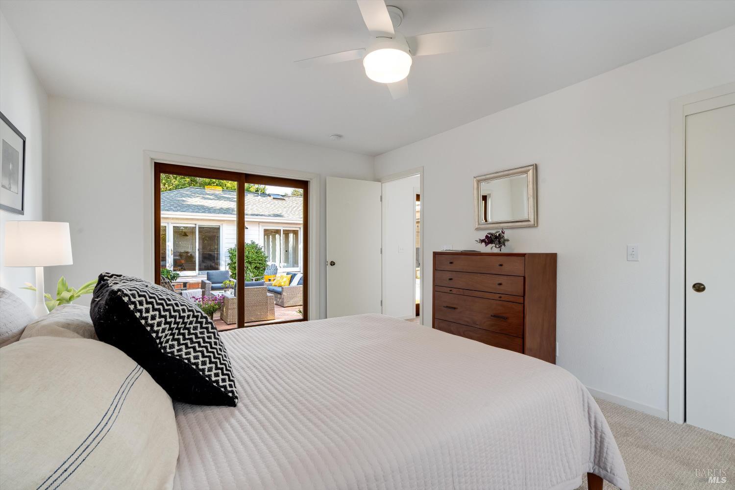 1777 Adams Street St. Helena, CA 94574 - Photo 23 of 31 a bedroom with a bed large window and closet