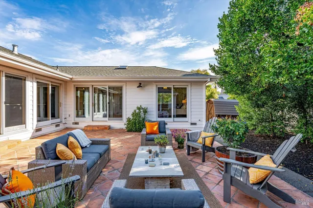 a view of swimming pool with outdoor seating