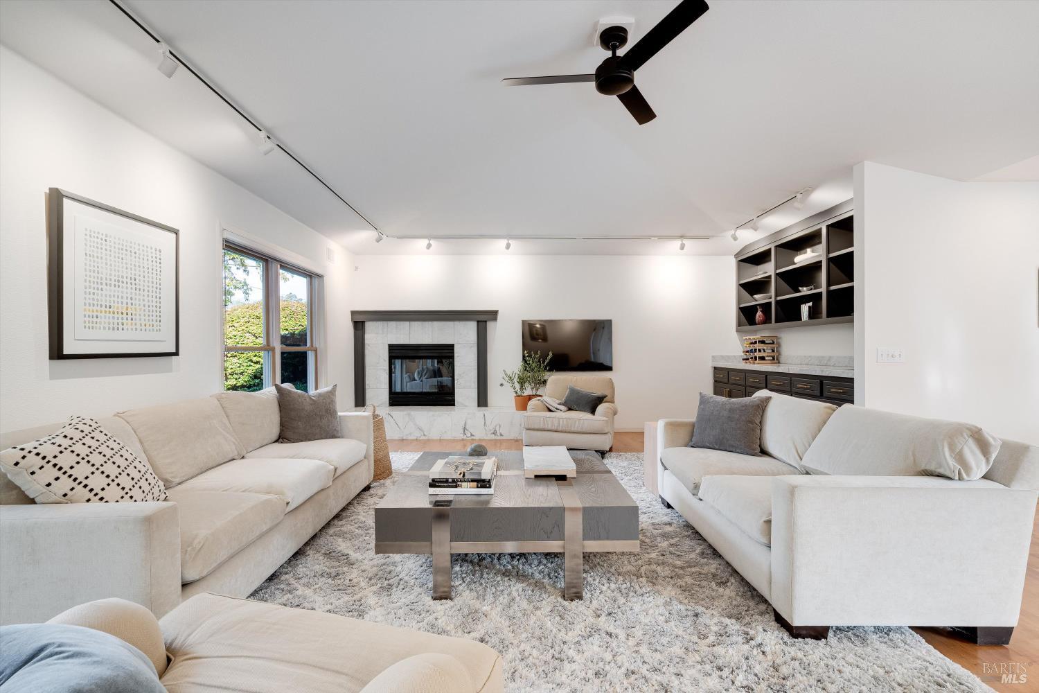 1777 Adams Street St. Helena, CA 94574 - Photo 9 of 31 a living room with furniture flat screen tv and window