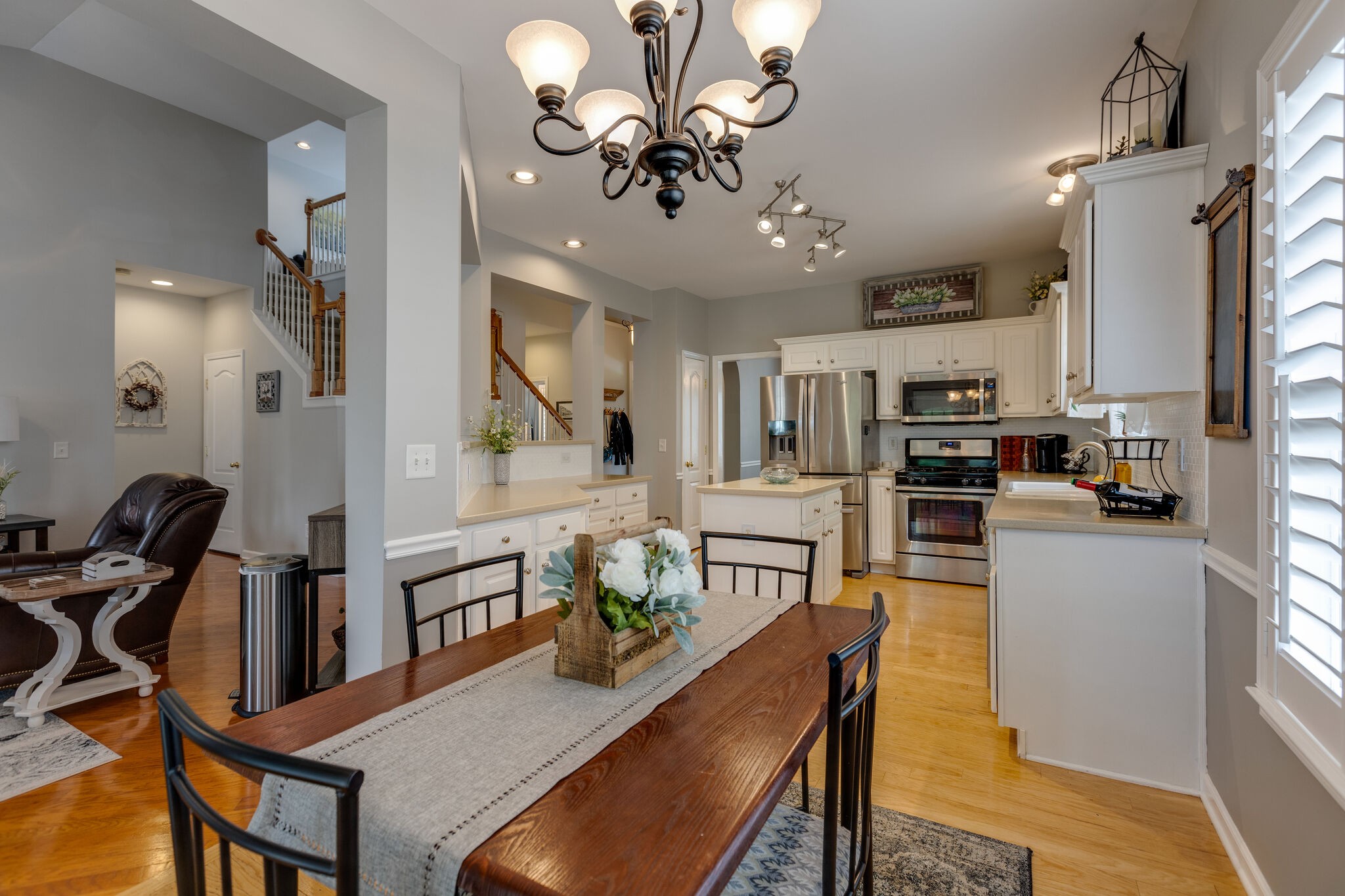 3133 Brimstead Drive Franklin, TN 37064 - Photo 12 of 32 a view of a dining room with furniture and a chandelier