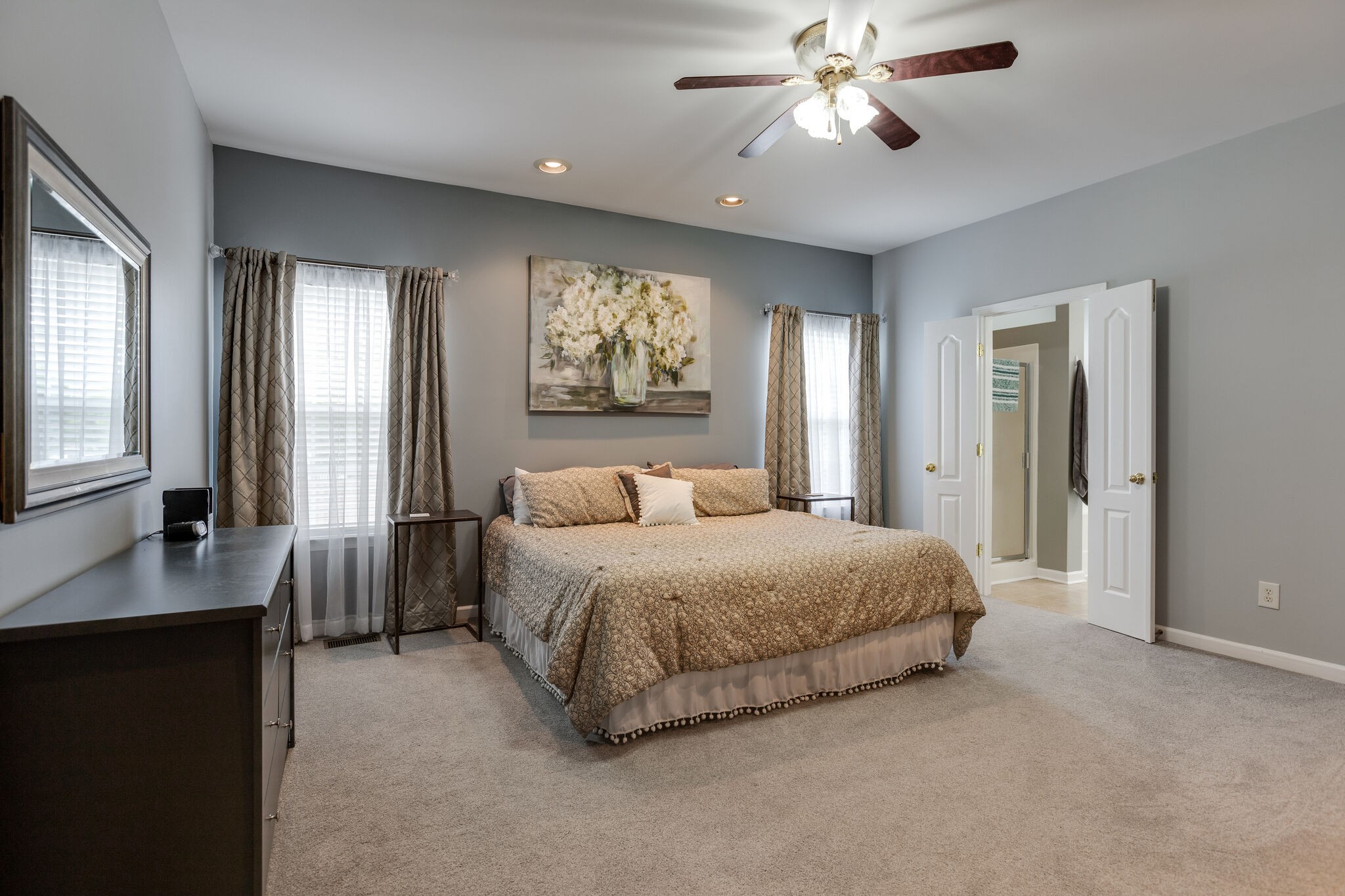 3133 Brimstead Drive Franklin, TN 37064 - Photo 19 of 32 a spacious bedroom with a bed and a chandelier