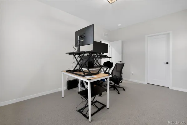 a view of a workspace with furniture