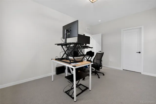 a view of a workspace with furniture