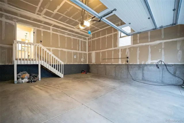 a view of a livingroom with furniture and a window