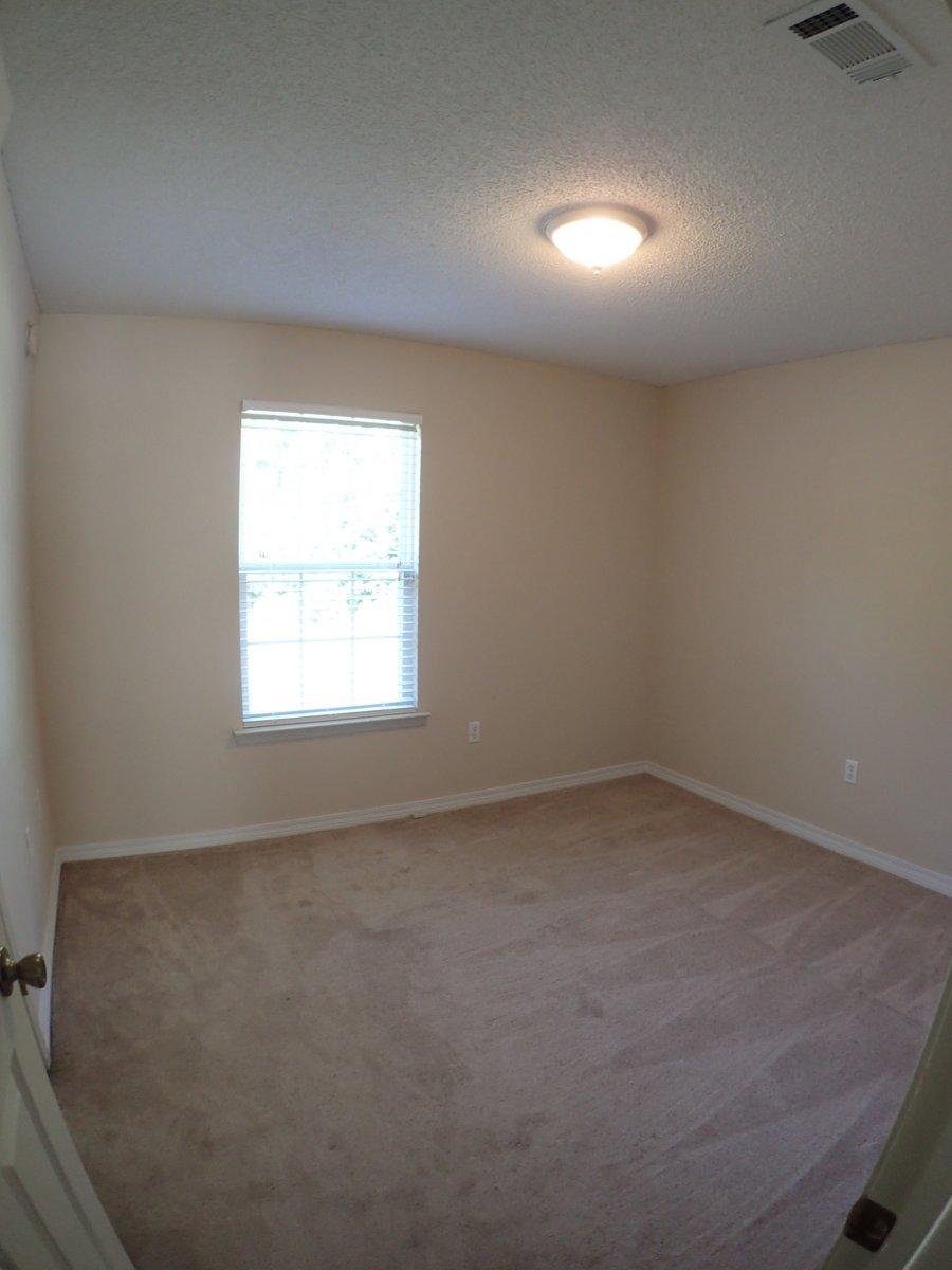134 Hampton Drive Crestview, FL 32539 - Photo 11 of 17 an empty room with a window