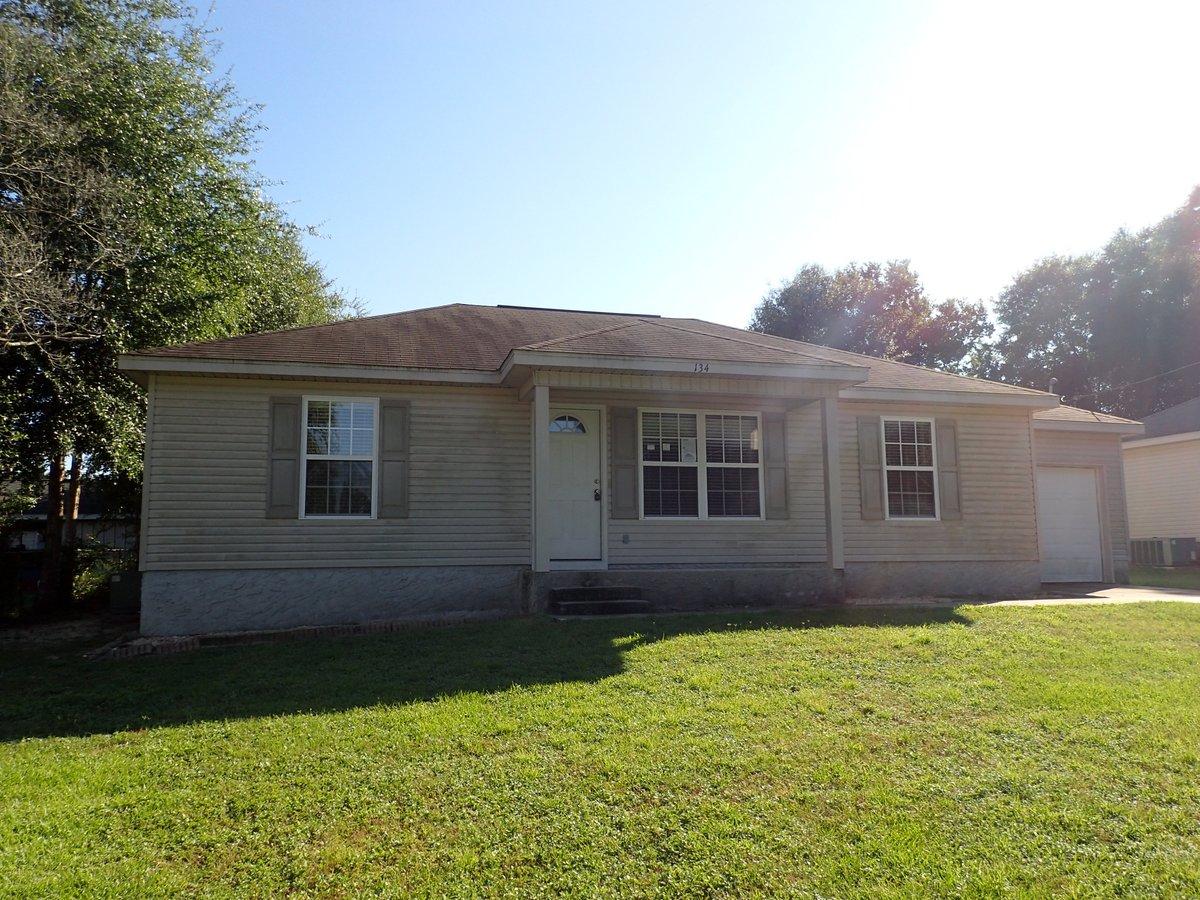 134 Hampton Drive Crestview, FL 32539 - Photo 13 of 17 a house view with a garden space